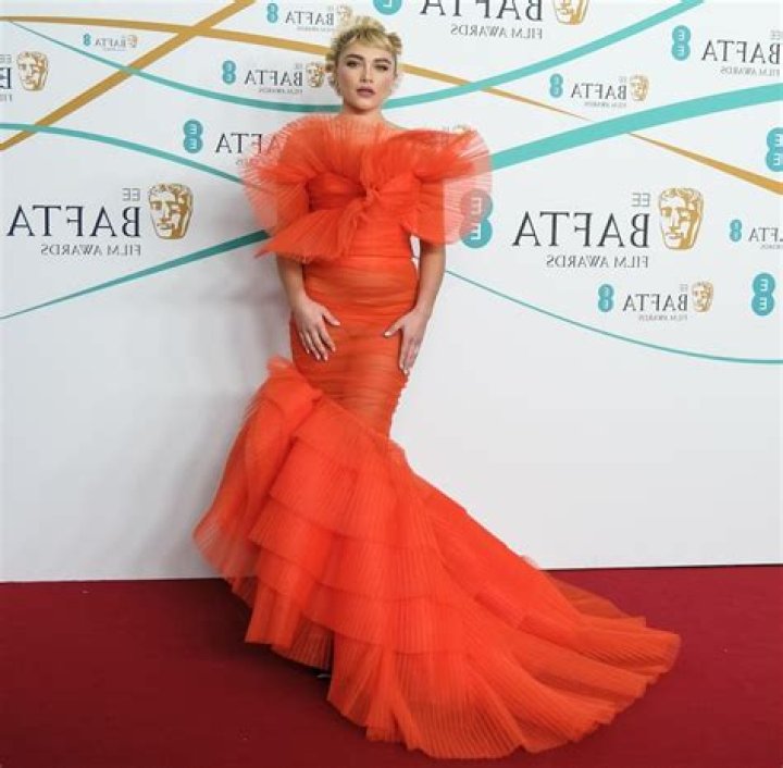 Florence Pugh wore custom Nina Ricci at the BAFTAs: orange you glad she did???