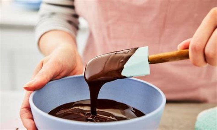 How do you add flavor to melted chocolate?