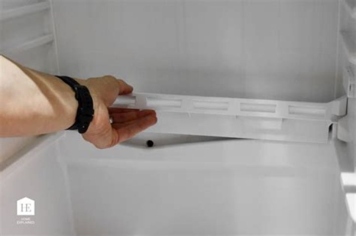 How do you remove a Maytag refrigerator door handle?