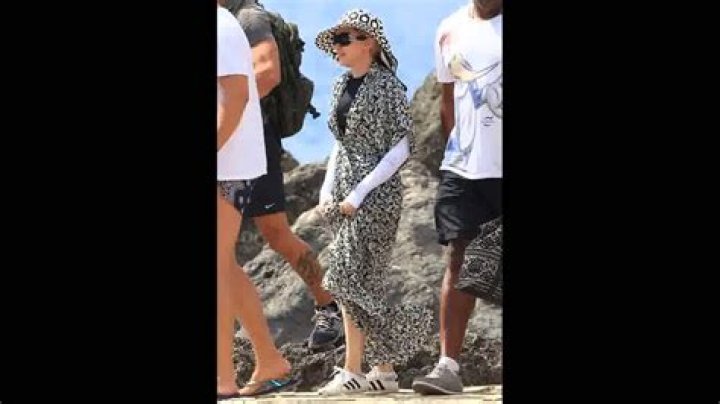 Madonna’s beachwear involves layers, a muumuu & a hat: funny or ridiculous?