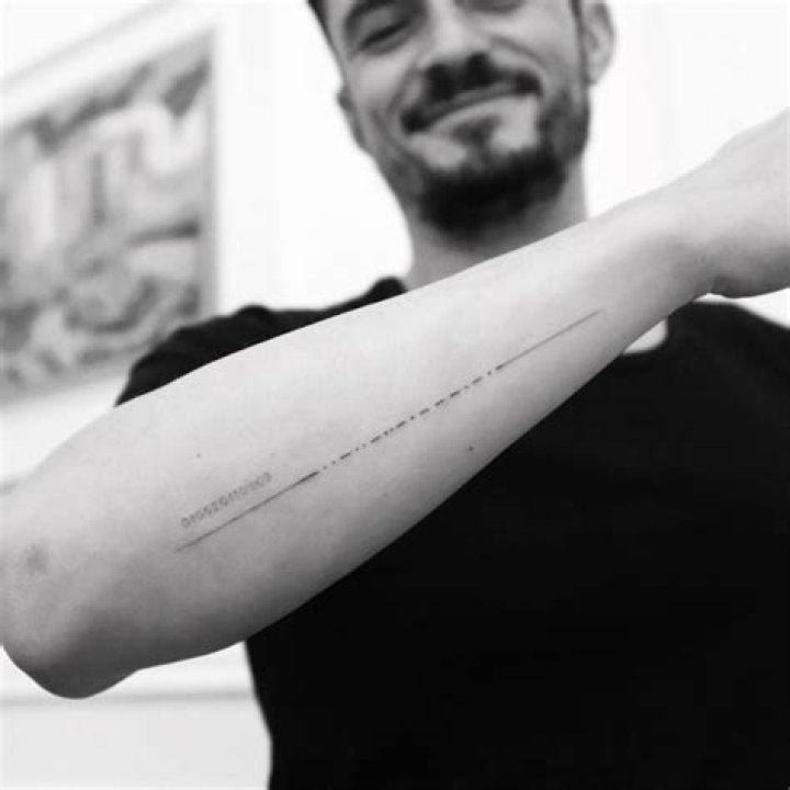 Orlando Bloom corrected his misspelled Morse code tattoo of his son’s name